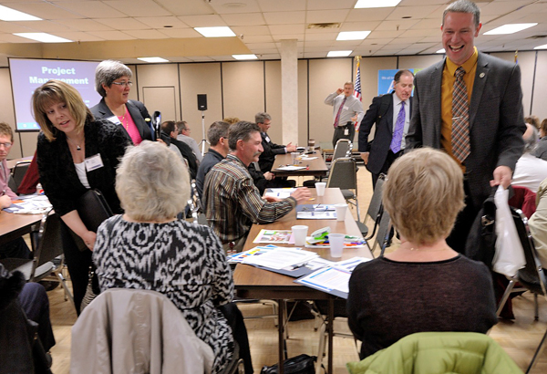 Photo of senior leadership team visiting employees in District *.